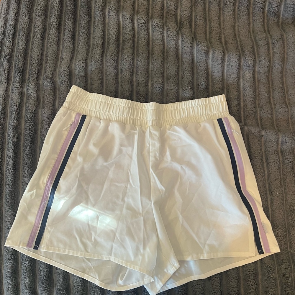 Calme White Women’s Athletic Shorts with Purple and Navy Side Stripes